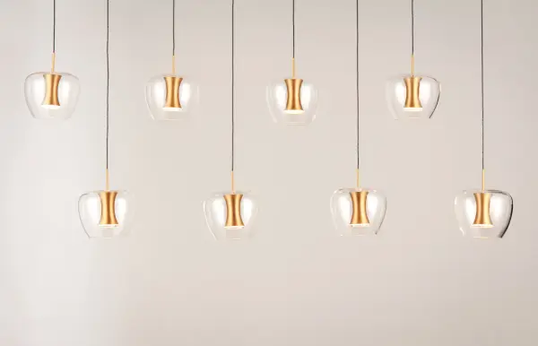 The Newton 8-Light Pendant combines contemporary design with practical LED illumination. Clear apple-shaped glass shades paired with mixed metal finishes create visual interest, while integrated LEDs provide efficient, glare-free lighting perfect for high-ceiling spaces. - alternate view