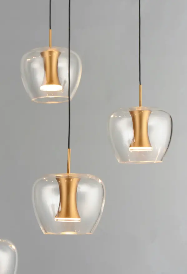 The Newton Multi-Light Pendant combines contemporary design with practical illumination. Clear apple-shaped glass shades paired with black and gold finishes create dramatic visual impact, while integrated LEDs provide even, glare-free lighting. - alternate view