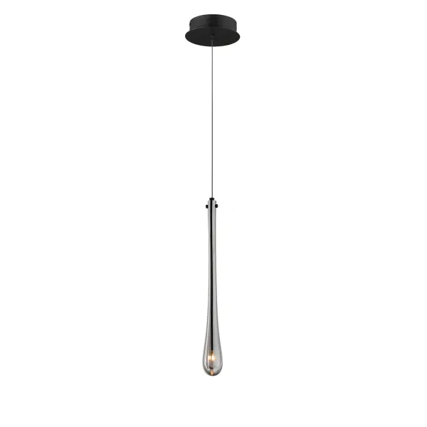 The Stillo Mini Pendant features luxurious hand-blown glass in an elongated teardrop form with a slender LED socket suspended within. The matte black finish paired with mirror smoked glass creates a moody, contemporary aesthetic perfect for intimate spaces.