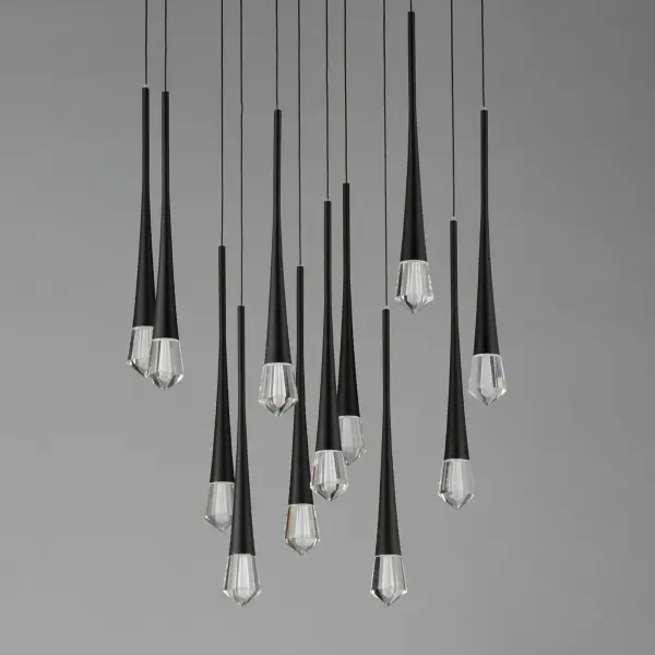 The Pierce chandelier makes a bold statement with its elongated multi-tier profile featuring 12 LED-illuminated faceted crystal elements suspended on thin black wires. The interplay of matte black metal and brilliant crystal creates stunning visual impact. - alternate view