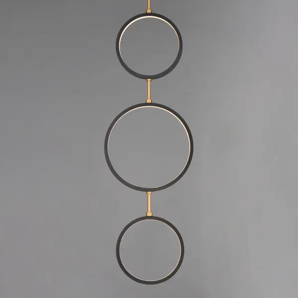 The Hoopla pendant features concentric rings in sophisticated black suspended from a gold column, creating a sculptural focal point. Its European-inspired design brings contemporary elegance to entryways and dining spaces. - alternate view