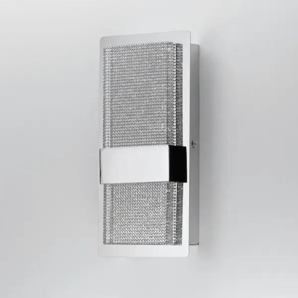 The Sparkler sconce features thousands of miniature crystals embedded in clear acrylic that sparkle like stars when illuminated. Combines glamorous aesthetics with practical downlighting in a sleek chrome frame. - alternate view