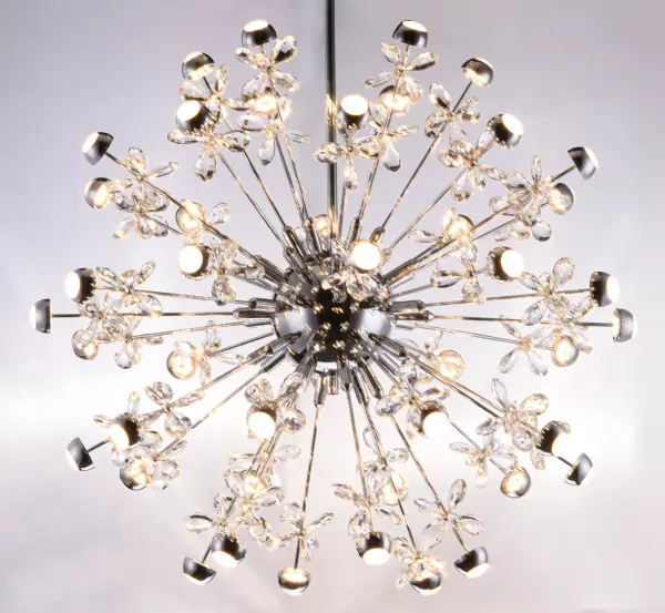 The Supernova pendant creates a stunning astronomical-inspired display with beveled crystals backlit by LED modules in polished chrome housings. This dramatic multi-light fixture delivers 3630 lumens of warm 3000K light with exceptional CRI 90 color rendering, perfect for making a bold statement in dining rooms, foyers, or grand living spaces. - alternate view