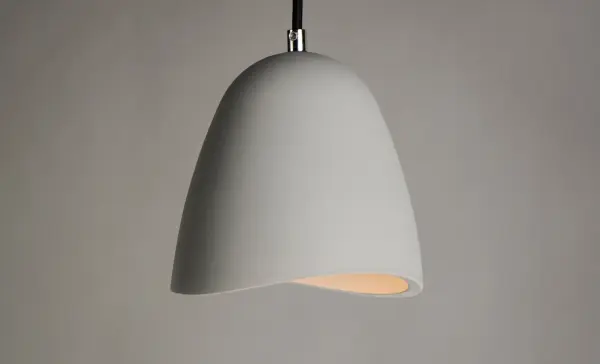 The Sway pendant combines contemporary style with industrial materials, featuring a distinctive gray concrete shade. Energy-efficient LED technology and dimmable functionality make it practical, while the unique gypsum and concrete construction offers durability at an accessible price point. - alternate view