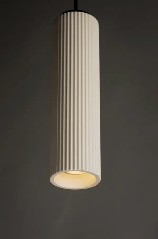 The Pleat Single Pendant combines textured white plaster with matte black structure for a striking contemporary look. Energy-efficient LED technology delivers bright, warm light with excellent color rendering, perfect for task lighting or accent applications. - alternate view