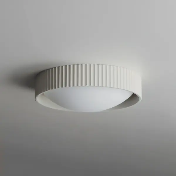 The Souffle combines organic cast concrete texture with modern LED efficiency. Its scalloped ramekin-inspired design adds sculptural character to compact spaces while providing warm, diffused illumination. - alternate view