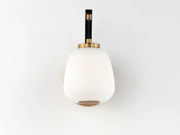 The Soji Wall Sconce brings serene illumination through its sculptural Satin White glass diffuser and striking Black and Gold two-tone frame. Energy-efficient LED technology delivers warm 3000K light with excellent color rendering. - alternate view