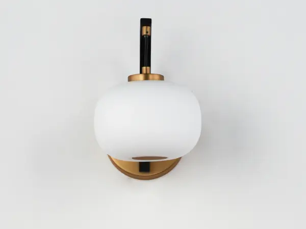The Soji Wall Sconce brings serene sophistication to any space with its Japanese lantern-inspired design. Satin white glass diffuses warm 3000K light while the striking black and gold two-tone frame adds sculptural presence. - alternate view