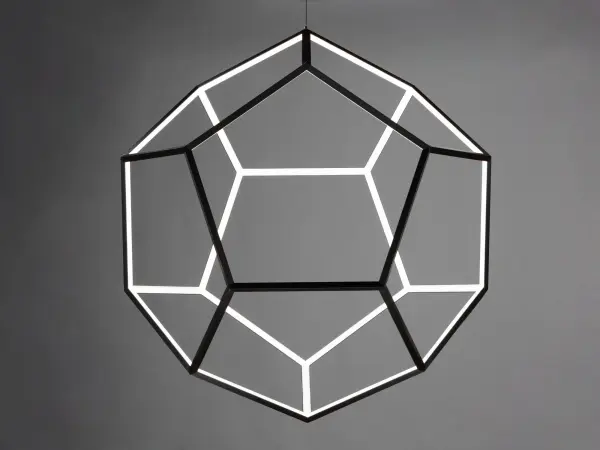 This extra-large spherical pendant features striking black pentagon geometry that creates captivating shadow patterns. With 6480 lumens of warm LED light, it delivers both dramatic visual impact and substantial illumination for grand spaces. - alternate view