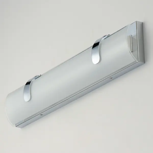 The Clutch LED Bath Vanity combines modern minimalism with functional lighting. Its curved opal white glass and polished chrome finish create a sophisticated look while delivering 1200 lumens of warm LED light. - alternate view