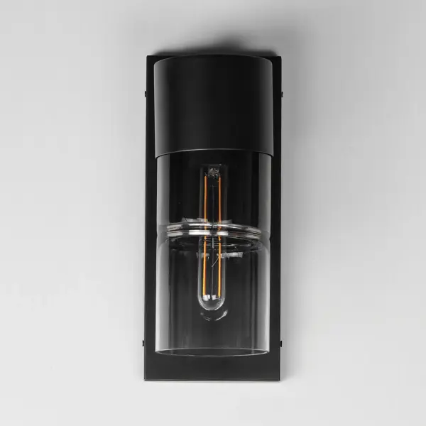 The Smokestack Small sconce combines nostalgic tubular LED design with modern durability. Segmented smoke gradient glass cylinders and matte black framing create ambient exterior lighting that's both functional and stylish. - alternate view