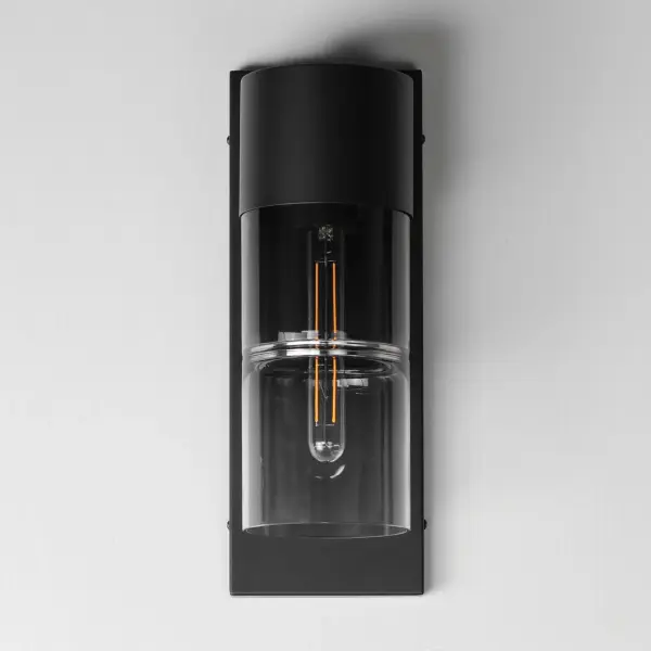The Smokestack sconce combines nostalgic industrial design with modern LED efficiency. Segmented smoke gradient glass cylinders and matte black steel frame create dramatic ambient lighting for exterior spaces. - alternate view