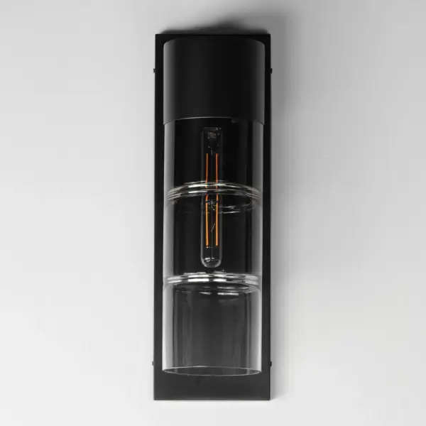 The Smokestack Large LED Outdoor Wall Sconce combines nostalgic industrial design with modern LED efficiency. Segmented smoke gradient glass cylinders and matte black steel frame create dramatic ambient lighting for exterior spaces. - alternate view