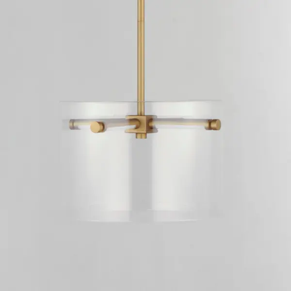 The Polo pendant combines sleek modern design with powerful LED lighting. Its clear glass cylinder and streamlined gold pole structure create a sophisticated look while delivering 990 lumens of warm light. - alternate view