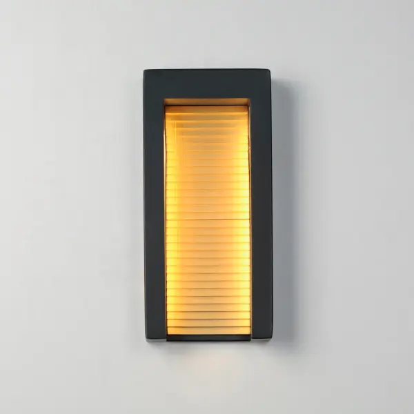 The Alcove wall sconce combines industrial design with sophisticated lighting. Die-cast aluminum construction houses corrugated stainless steel panels in gold, creating warm ambient light through LED reflection. - alternate view