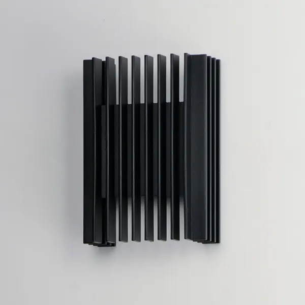 The Rampart Small LED Outdoor Wall Sconce combines sharp rectilinear design with efficient LED technology, creating dramatic upward and downward light patterns. Its matte black aluminum construction and compact size make it ideal for modern exteriors. - alternate view