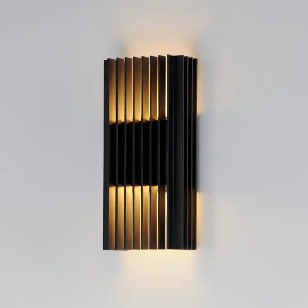 The Rampart sconce delivers sophisticated outdoor lighting with sharp rectilinear lines and dual-direction LED illumination. Its matte black finish and geometric design create dramatic light patterns while complementing contemporary architecture. - alternate view
