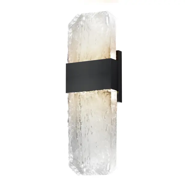 The Rune outdoor wall sconce showcases handcrafted cast glass slabs with unique imperfections, elevated by concealed LED lighting. Its durable aluminum construction and weather-resistant black finish make it ideal for exterior applications.