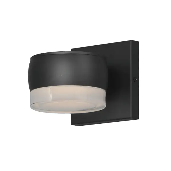 The Modular Can LED Sconce combines minimalist design with practical functionality. Its streamlined aluminum disc and modular shade options deliver 450 lumens of warm LED light while meeting Dark Sky standards.