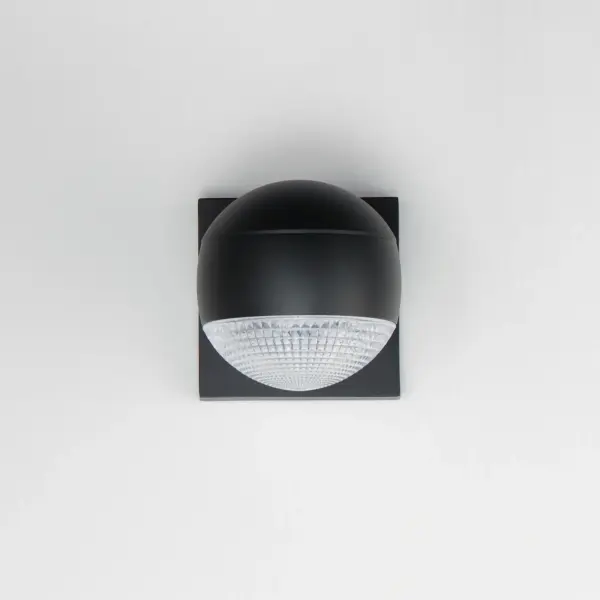 This streamlined outdoor wall sconce combines modern minimalism with practical functionality. The cast aluminum construction and Dark Sky compliant design make it ideal for eco-conscious applications, while multiple lens options provide design versatility. - alternate view