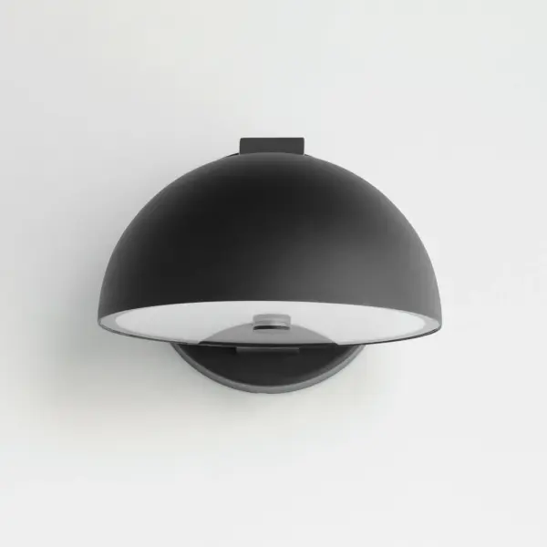 The Cauldron outdoor wall sconce draws inspiration from the Olympic cauldron with its distinctive upward or downward mounting capability. Constructed from durable aluminum with stainless steel accents, this 7-inch LED fixture delivers 900 lumens of warm 3000K light, perfect for illuminating outdoor spaces with contemporary flair. - alternate view