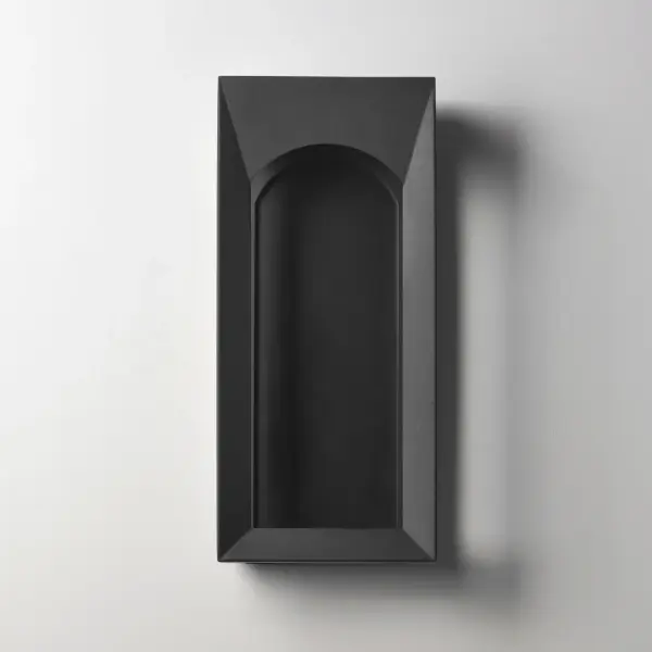 The Brasilia LED outdoor sconce brings grand architectural elegance to exterior spaces with its 304-grade stainless steel cage featuring distinctive beveled arches. The integrated LED provides efficient illumination in a matte black finish. - alternate view