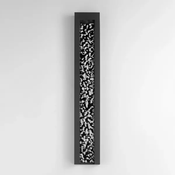 The Liquid wall sconce brings architectural drama with its elongated channel design that mimics flowing water. Premium 304 stainless steel construction ensures durability in outdoor conditions while the sleek black finish adds contemporary elegance. - alternate view
