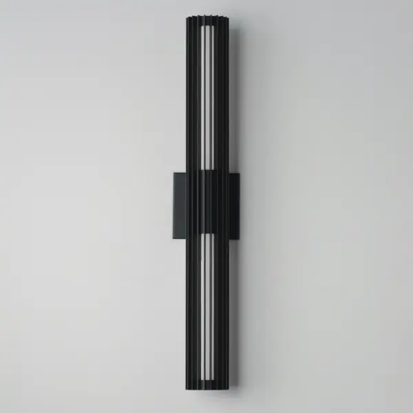 The Citadel outdoor wall sconce features a contemporary vertical aluminum frame surrounding an LED tube that delivers 1600 lumens of warm 3000K light. Its slim 4" profile makes it ADA compliant while the matte black finish suits diverse architectural styles. - alternate view