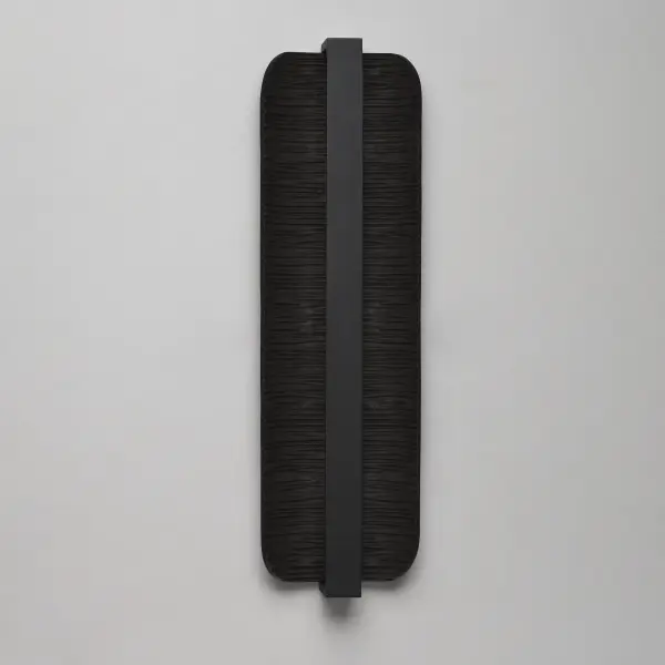 The Terra sconce combines artistic design with practical functionality. Its rough-hewn cast aluminum plate features an erosion pattern that creates dramatic shadows when illuminated by indirect LED lighting. ADA compliant with warm 3000K output. - alternate view