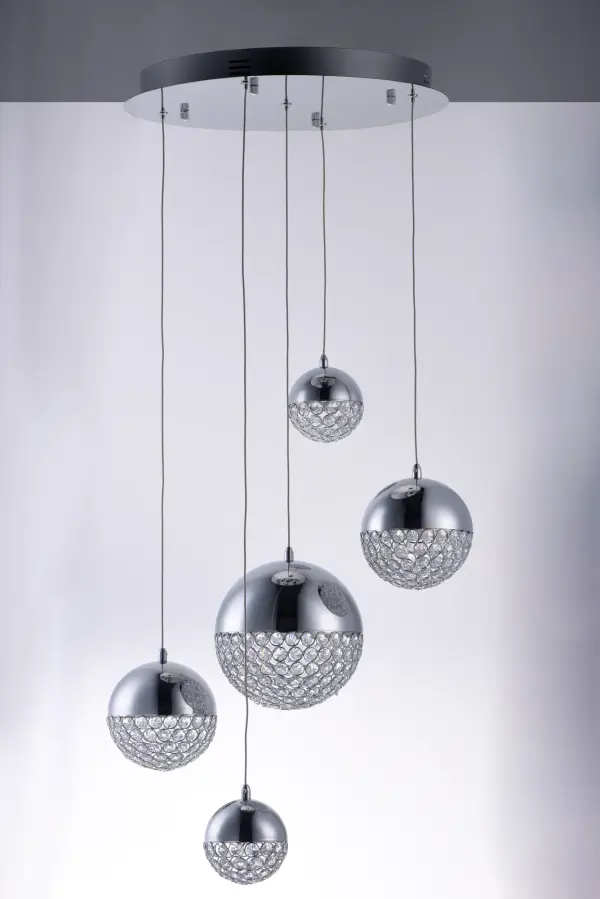 The Eclipse pendant combines polished chrome spheres with hand-woven beveled crystal beads to create a dazzling light display. Integrated LED technology illuminates the crystals from above, producing brilliant sparkle and ambiance. - alternate view