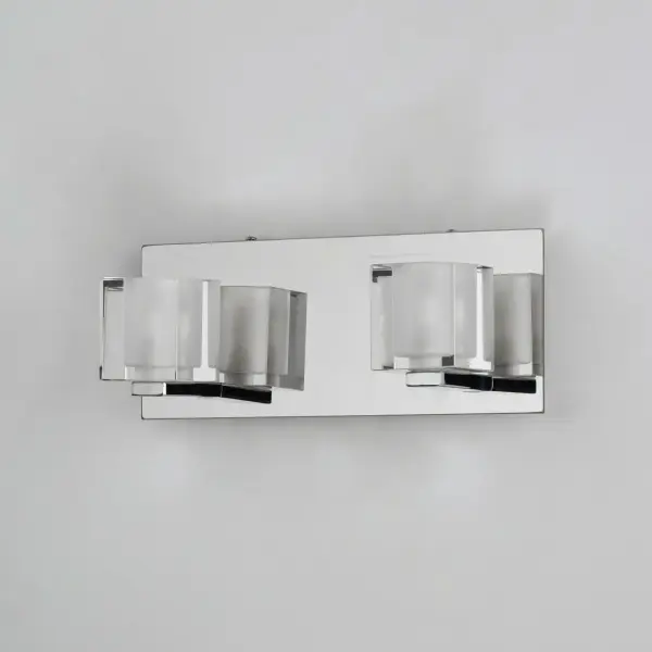 The Blocs LED Wall Sconce combines architectural geometry with energy-efficient LED technology. Thick clear and frosted glass blocks create visual interest while the polished chrome frame adds reflective brilliance to any space. - alternate view