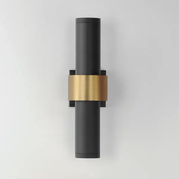 This large tubular wall sconce combines contemporary design with versatile indoor-outdoor functionality. The Sandy Black finish with Gold stainless steel band creates a stunning reveal effect, casting soft ambient light both downward and behind the band for dramatic visual impact. - alternate view