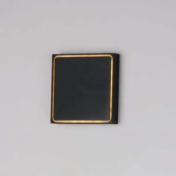 The Alumilux Outline delivers clean, architectural lighting with energy-efficient LED technology. Its minimalist black aluminum frame and acrylic diffuser create subtle ambient illumination perfect for modern exteriors. - alternate view