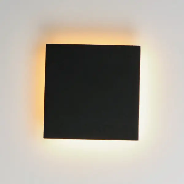 The Alumilux Tau delivers efficient LED lighting in a minimalist aluminum design. Perfect for modern exteriors, this compact wall sconce provides 490 lumens of warm 3000K light with durable weather-resistant construction. - alternate view