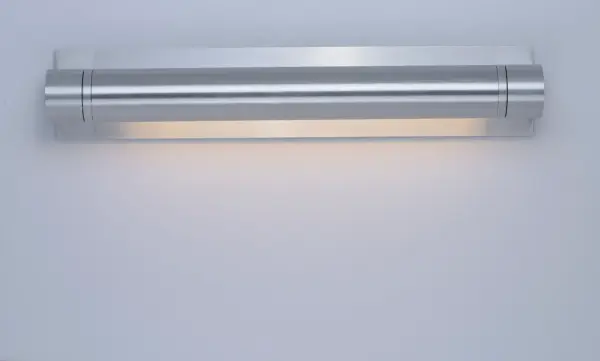 This solid aluminum wall sconce combines European architectural design with high-powered LED technology. Machined from solid aluminum blocks with a satin finish, it delivers 420 lumens of warm 3000K light through an acrylic diffuser. - alternate view