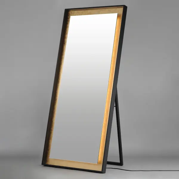 This 30" x 67" free-standing LED mirror combines functional lighting with sophisticated design. The gold leaf and black finish frame adds a glamorous touch while integrated 3000K LED lighting provides flattering illumination. - alternate view