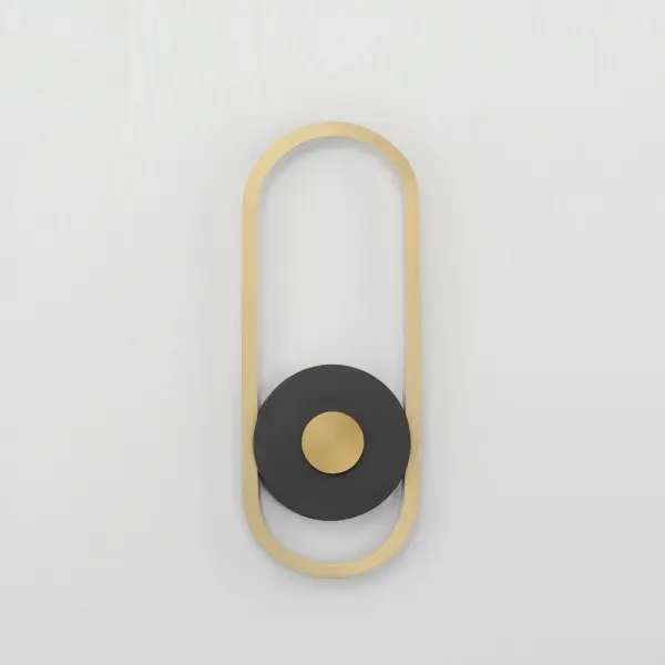 The Gravity sconce combines contemporary design with practical outdoor durability. Its elliptical gold element contrasts beautifully against a black disc, while corrosion-resistant aluminum and UV-rated finishes ensure longevity in wet locations. - alternate view