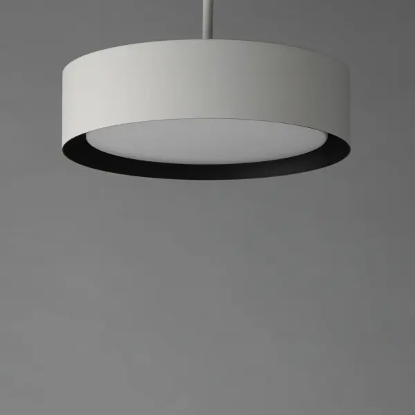 The Echo pendant combines practical design with contemporary style. Its dual-shade construction features a metal drum exterior in matte white with a black interior that reduces glare, while an internal acrylic diffuser ensures even LED light distribution. - alternate view