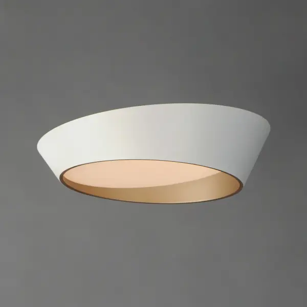 The Slant flush mount brings architectural interest to ceilings with its unique angled profile. The matte white exterior paired with a gold interior creates subtle warmth while the LED technology provides efficient, quality illumination. - alternate view