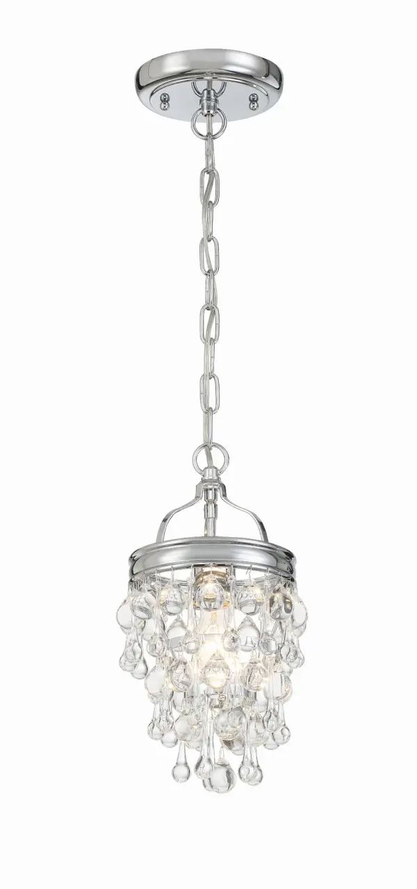 The Calypso mini chandelier delivers sophisticated sparkle in a compact 7.25" footprint. Draped with clear crystal drops and balls, it brings glamorous lighting to smaller spaces like bathrooms, closets, and hallways.