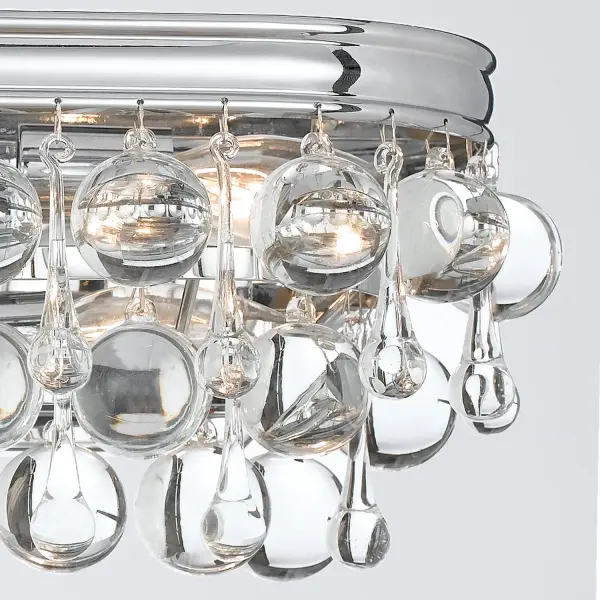 The Calypso vanity light brings sophisticated glamour to bathroom spaces with its abundance of clear crystal drops and balls. The polished chrome finish and contemporary design create a statement piece perfect for modern bathrooms. - alternate view