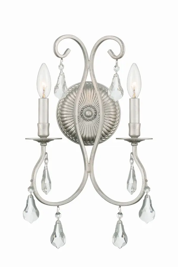 The Ashton sconce combines classic elegance with sparkling crystal accents. Its curvaceous lines and hand-painted Olde Silver finish create a sophisticated look perfect for bathrooms, bedrooms, and hallways.