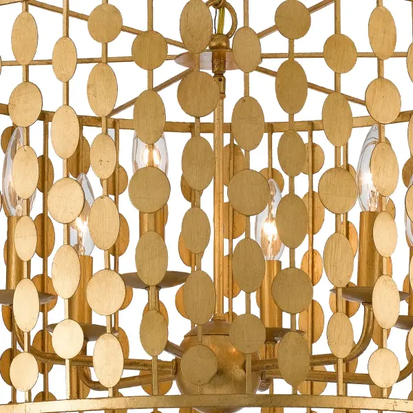 The Layla Chandelier features wafer-thin metal discs arranged in concentric circles, creating a sophisticated focal point. Its Antique Gold finish adds warmth while maintaining contemporary appeal, making it versatile across decor styles. - alternate view