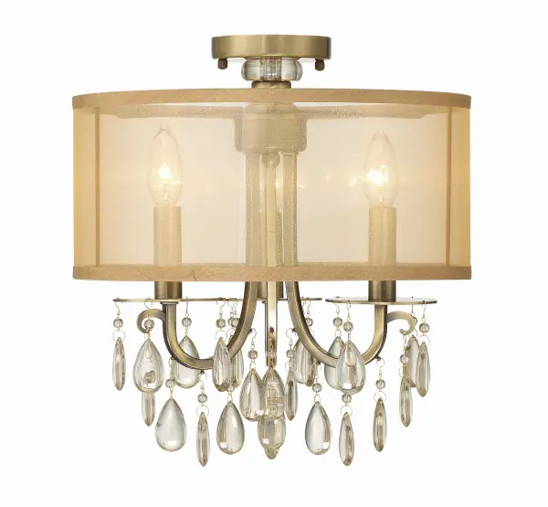 The Hampton combines classic elegance with modern minimalism through its shimmering drum shade and hand-cut crystal accents. Perfect for spaces needing sophisticated lighting without pendant drop.