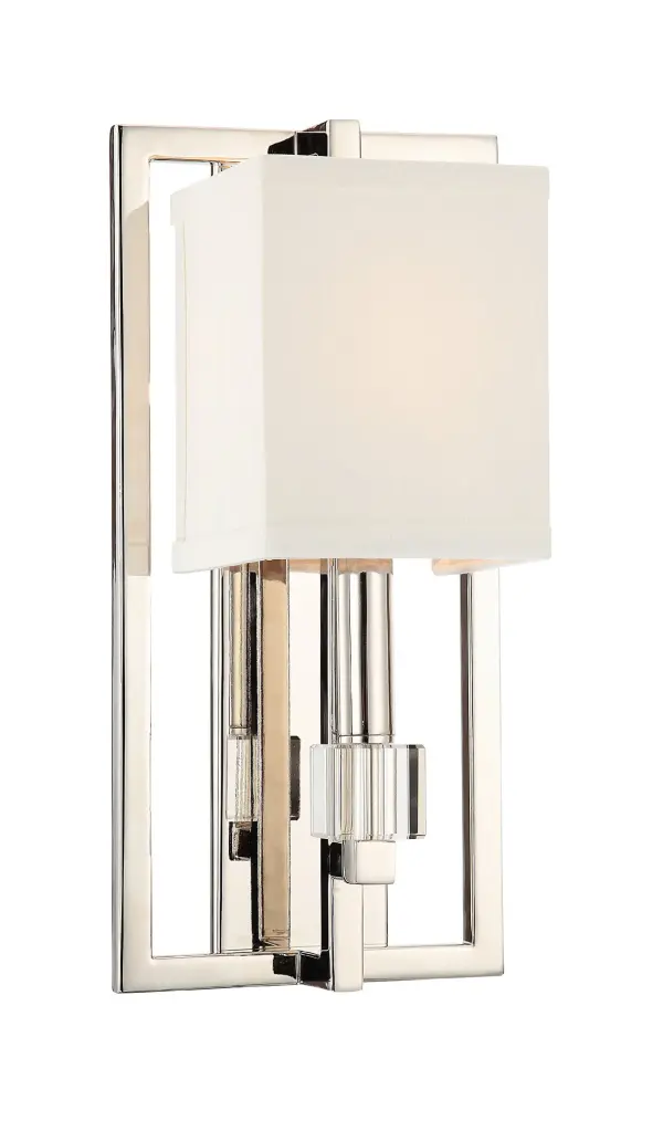 The Dixon sconce combines geometric precision with luxurious details, featuring a squared metal frame in polished nickel, white fabric shades, and gleaming crystal cube accents for refined transitional style.