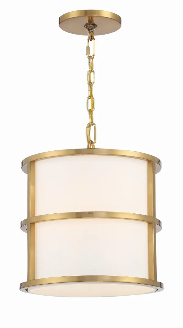 The Hulton Pendant by Brian Patrick Flynn reimagines the classic drum chandelier with a striking geometric metal frame surrounding a white fabric shade. Its bold graphic lines and sculptural form make it a statement piece.