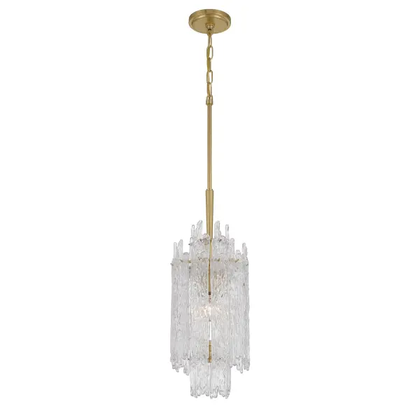 The Ackerly chandelier features stunning textured ice glass that creates a soft, diffused glow reminiscent of frozen crystal. Its compact 8.5" size and aged brass finish make it perfect for intimate spaces or grouped installations.