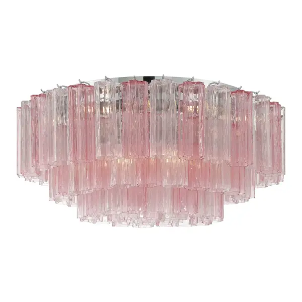 The Addis 32" Flush Mount reimagines the legendary mid-century Tronchi chandelier with transparent tiers of textured glass tubes arranged in a mesmerizing 5-point star. The Aged Brass frame and warm amber glass create sophisticated ambiance.