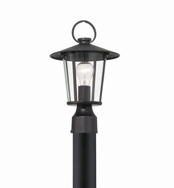 The Andover outdoor post light combines iconic street lantern design with contemporary farmhouse aesthetics. Its tapered column and clear glass panels deliver authentic charm and excellent illumination for various exterior settings. - alternate view