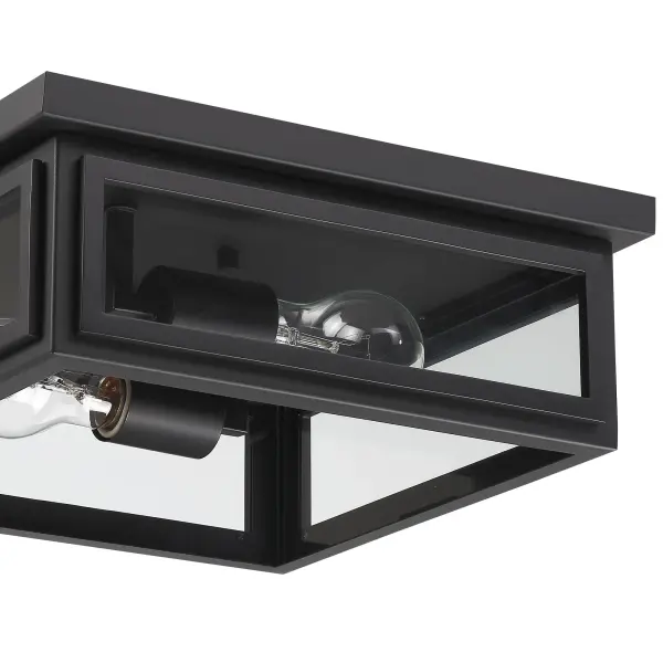 The Byron flush mount combines modern design with transitional appeal, featuring a tapered rectangular clear glass shade and matte black finish. Wet-rated for exterior use, it delivers bright illumination for entries, patios, and terraces. - alternate view